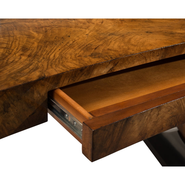 Closeup of the Curved Walnut Desk by John Richard, showing the high-end home office desk's open drawer.