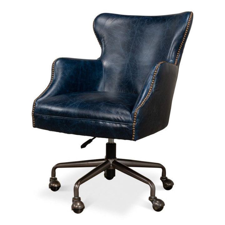 Indulge in the luxury of the Andrew Jackson Desk Chair by Sarreid, upholstered in pure aniline top-grade cowhide leather. This Chateau Blue masterpiece features bronze nailhead trim along the edges, padded armrests, a cushioned seat, a swivel base, and five caster wheels for seamless mobility.