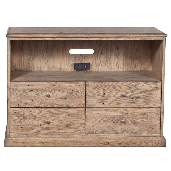 The Arcadian Lateral File Cabinet by Fairfield Chair exudes rustic charm with its wooden design, featuring an open shelf at the top and four drawers arranged in two rows below. The open shelf includes a cut-out hole for cables and a built-in electrical outlet with two sockets and two USB ports, blending modern functionality with its minimalistic elegance.