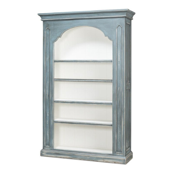 The Banner Bungalow Bookcase by Sarreid is a vintage-style, tall wooden bookcase in distressed blue with a white interior. Featuring four shelves for storage and display, an arched top frame, and paneled sides made from Russian pine, it perfectly embodies the rustic, antique charm of the Bungalow Collection.