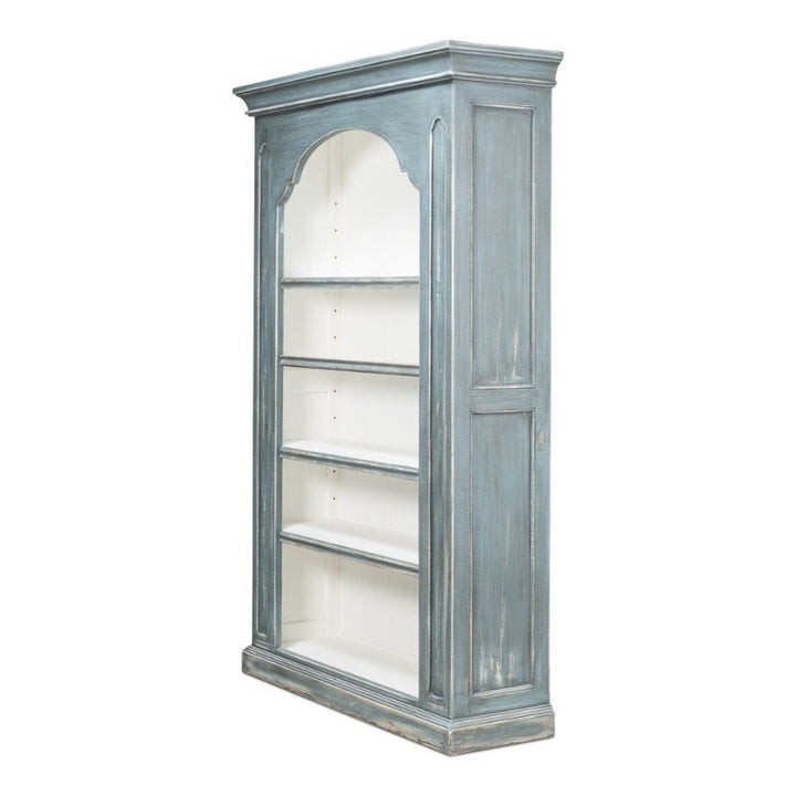 Introducing the Banner Bungalow Bookcase by Sarreid, a tall, vintage-style bookshelf from the Bungalow Collection. Crafted from Russian pine, this distinguished piece boasts a distressed blue-gray finish complemented by a white-painted interior. It features four spacious shelves and an arched top adorned with decorative molding, imbuing your space with antique charm.