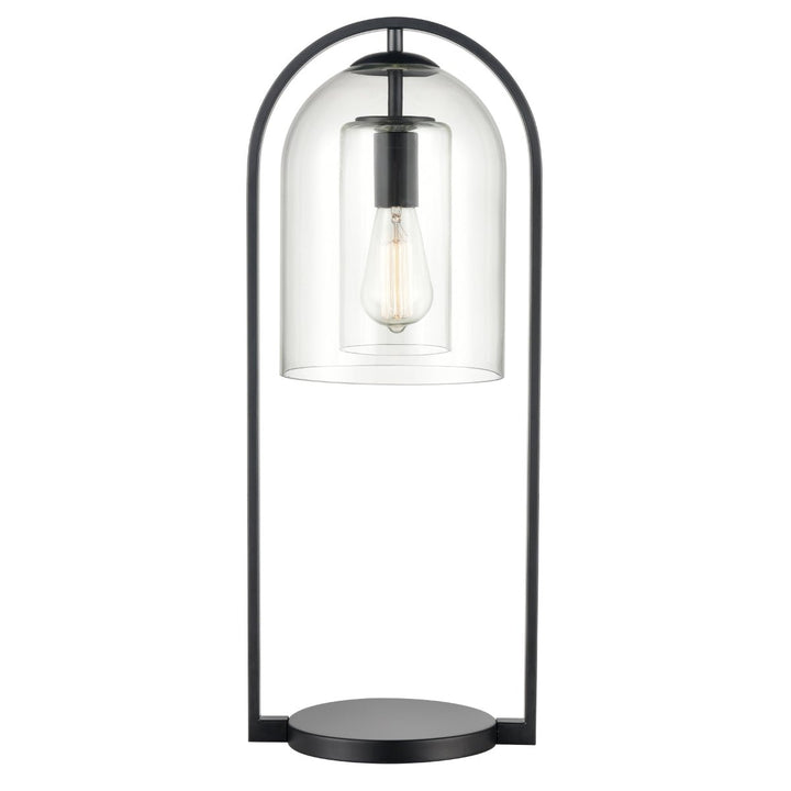 The Elk Home Bell Jar 28'' High 1-Light Desk Lamp features a black metal frame and a clear glass dome that highlights an exposed Edison bulb. Its circular base enhances the minimalist design, while the modern farmhouse style exudes aged brass elegance to underline its simplicity.