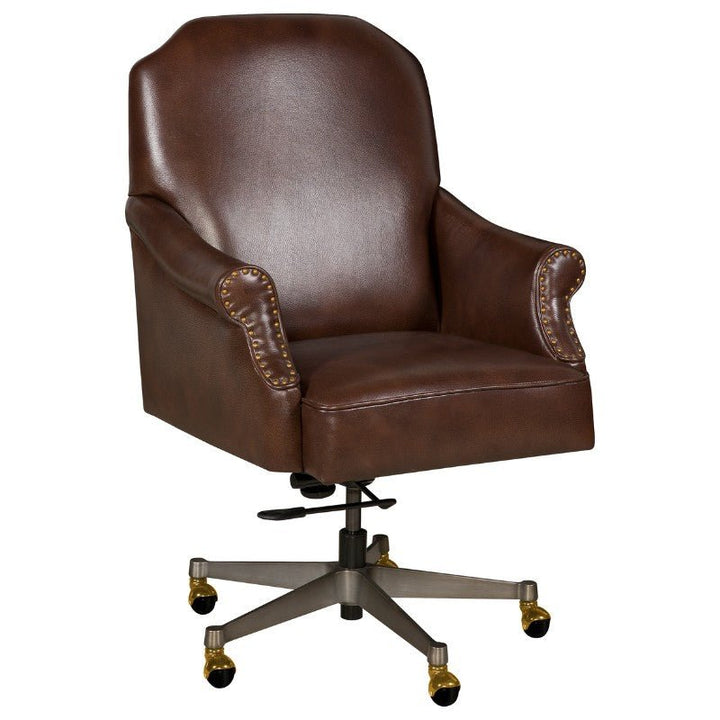 The Fairfield Chair's Chase Office Swivel Chair showcases buttery-soft aniline leather in a deep brown shade, accentuated by brass nail head trim detailing. This sophisticated chair is designed with padded armrests, a plush seat and backrest, all supported by a durable metal swivel base equipped with five casters for effortless mobility.