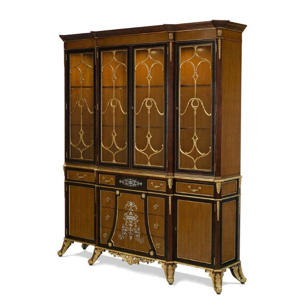 The Eucalyptus and Gold Gilt Breakfront Bookcase by Aston Court is a large, ornate wooden china cabinet with four glass-paneled upper doors featuring intricate gold designs and adjustable shelves. The lower section has solid cabinet doors and drawers, embellished with gold accents and decorative motifs. The cabinet stands on elegant, curved legs.