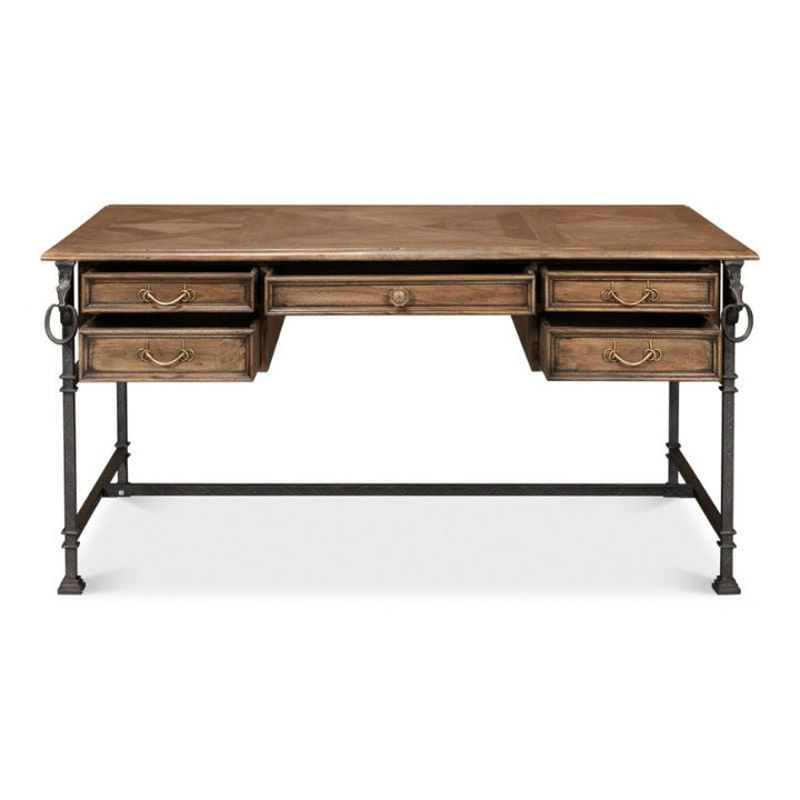 The Game Of Thornes Desk by Sarreid is a distinctive wooden desk with a rectangular top and five drawers, including two on each side and one central. The desk features a sturdy black metal frame and decorative handles on the drawers. Its reclaimed old wood surface has a natural finish, beautifully showcasing the grain patterns.