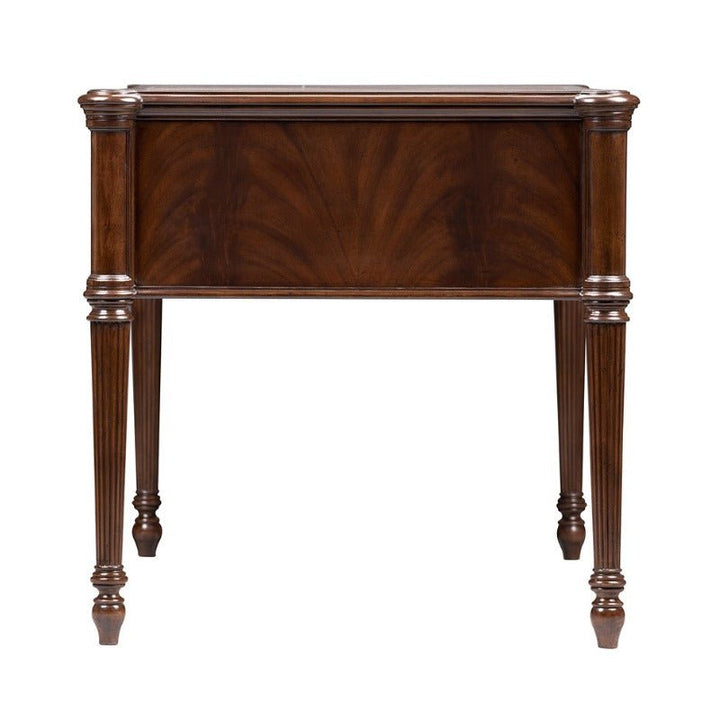 A vintage Mahogany Lady's Desk from Aston Court features a rectangular design with four intricately turned legs adorned with ornate carvings. The desk boasts a luxurious crotch mahogany finish that has a slightly reflective surface, showcasing its classic and elegant style.