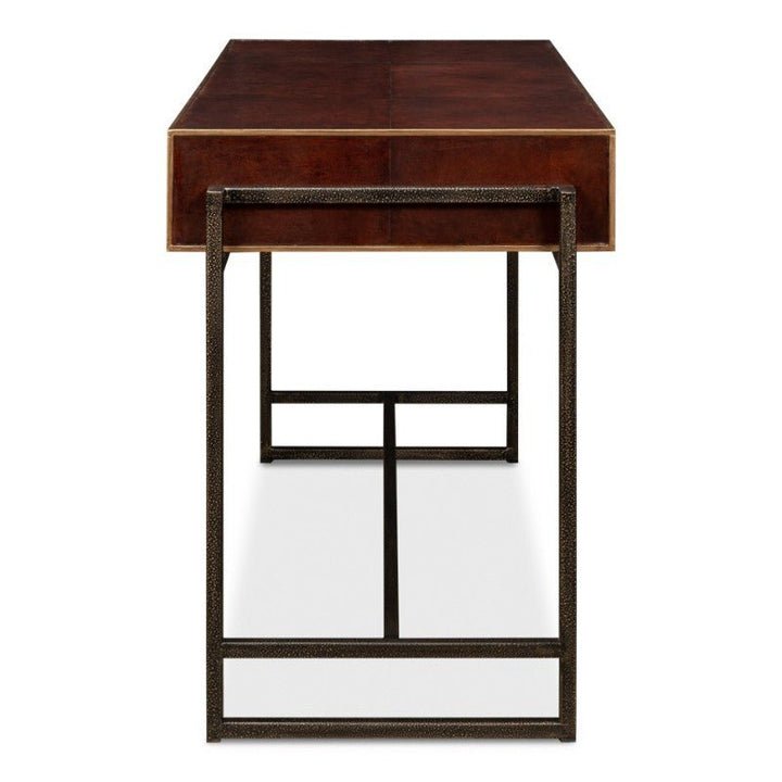 The Old Leather Desk, Iron Frame, 49" - Sarreid by Sarreid is a sleek and modern piece featuring a dark wooden surface and a minimalist design. The metal legs form a rectangular outline, seamlessly blending into its transitional style. The hand-colored leather top provides a rich, polished finish to the desk's textured iron frame.