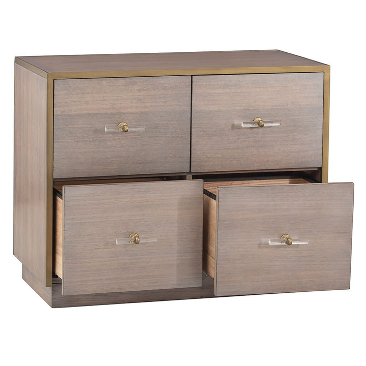 A wooden chest with four spacious drawers, two open, boasts a minimalist design with brass handles and a Grecian Clay finish. Modeled after Fairfield Chair's Park Avenue Lateral File Cabinet, the sleek eucalyptus wood construction brings a modern touch to any space.