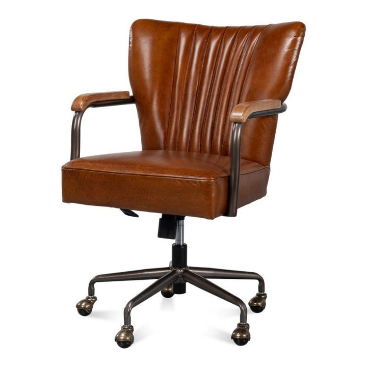 The Sarreid Parker Office Chair in Vintage Havana Leather features a timeless design made from top-grain cow leather. This brown leather office chair includes a ribbed backrest, metal armrests with padded leather, and a five-wheel metal base. Its adjustable height mechanism ensures comfort and style in any workspace.