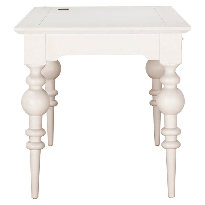 A small, white wooden table with ornate, rounded legs and a flat rectangular top. The Portofino Desk by Fairfield Chair combines minimalist and classical design elements, featuring turned leg details that add an elegant touch to its overall appearance.