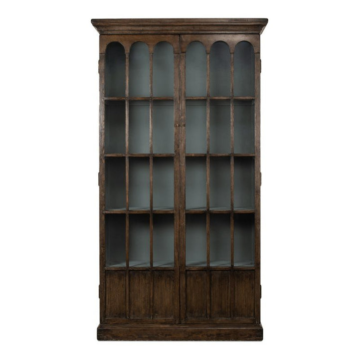 The Refined Arches Tall Bookcase by Sarreid features elegant arches in its upper design and a solid wood base. This tall, dark wooden bookcase includes two glass doors and boasts a light-painted interior that contrasts beautifully with the exterior, providing ample storage space for your collection.