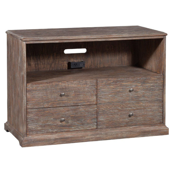 The Rustique Lateral File Cabinet by Fairfield Chair combines rustic elegance with modern functionality. This wooden cabinet features a natural finish, an open shelf with a cable management hole, a double power outlet, and four small drawers with metal knobs for storage—perfect for organizing electronics and media accessories.