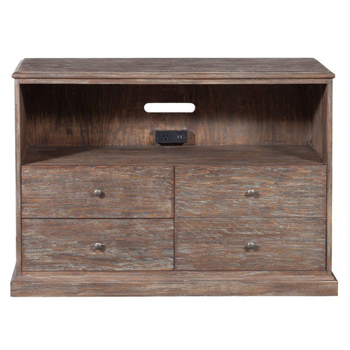 The Rustique Lateral File Cabinet by Fairfield Chair exudes rustic elegance with its weathered wooden finish. It features an open shelf equipped with modern functionality, including a built-in power outlet and USB ports at the back. Below the shelf, four small drawers with round metal knobs complete the charming look.