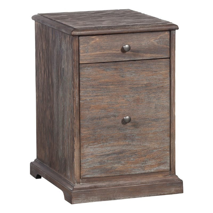 The Rustique Writing Desk and Mobile File by Fairfield Chair exudes rustic elegance, featuring a single drawer at the top and a larger cabinet door below. Both the drawer and cabinet door are adorned with round metal knobs, and the base boasts a decorative trim.