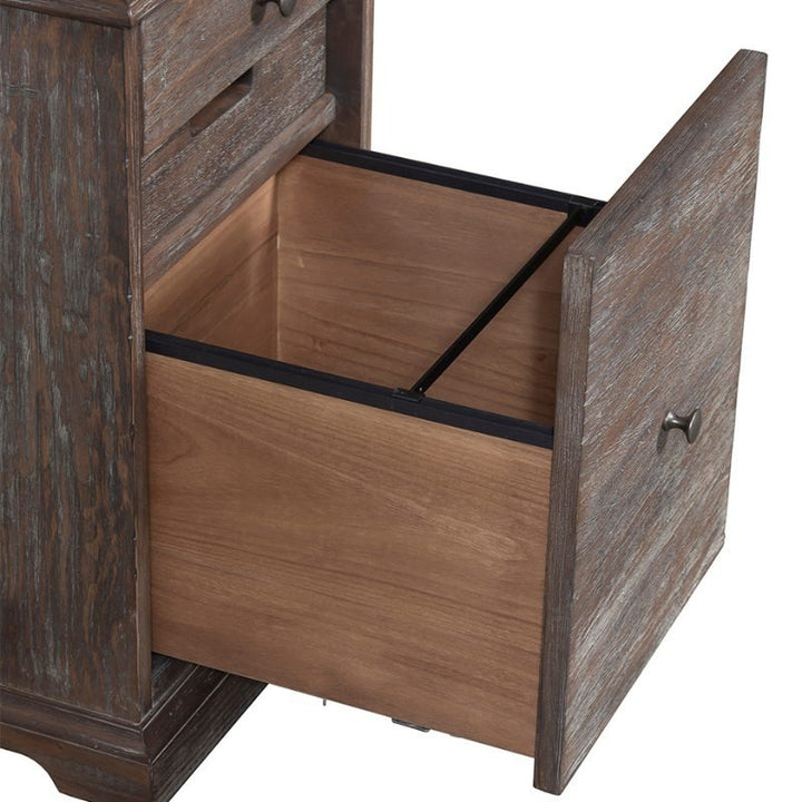 A close-up of the Fairfield Chair Rustique Mobile File, part of the Rustique Writing Desk and Mobile File collection, featuring an open lower drawer. The drawer has a spacious interior and metal rails designed for file organization. The cabinet exudes rustic elegance with its weathered finish, visible wood grain, and metal handles on the drawers.