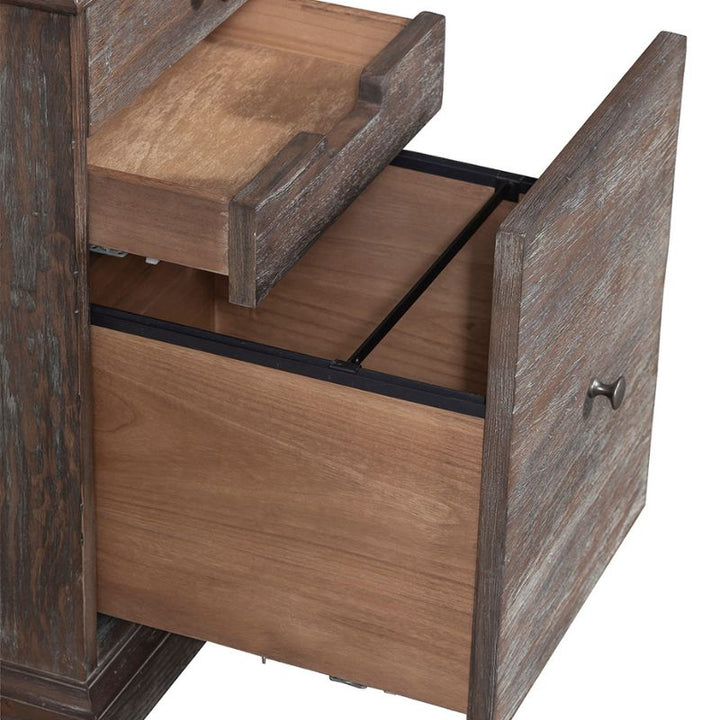 A wooden cabinet with two open drawers exudes rustic elegance. The upper drawer is smaller, while the lower one is larger, both showcasing a weathered finish and visible wood grain. With its metal handles and natural charm, this piece resembles a mini Rustique Writing Desk and Mobile File by Fairfield Chair.