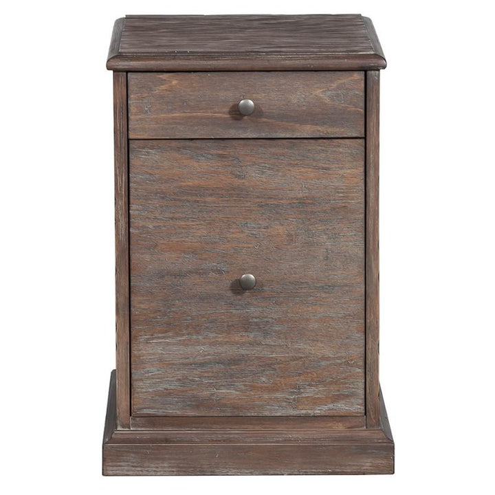 A rustic wooden writing desk and mobile file from Fairfield Chair exude rustic elegance. The desk features one small drawer at the top adorned with a round metal knob and a larger cabinet door below, both with matching round metal knobs. The base of the desk is slightly wider, adding stability.