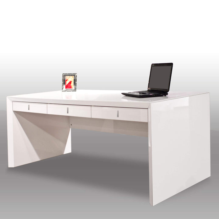 The Sharelle Bellini Desk by Sharelle Furnishings is a modern white lacquer desk with a glossy finish, featuring three drawers. On top of the desk sits a laptop and a small framed photo. The background is minimalist with a gradient from white to light gray, emphasizing the sleek design of this home office desk.