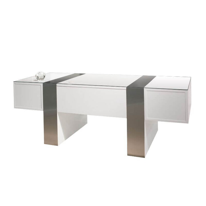 The Sharelle Nero Desk by Sharelle Furnishings boasts a sleek design with a high-gloss white lacquer finish. It features two storage compartments on each side adorned with metallic accents, and includes a small decorative glass ornament on the left compartment.