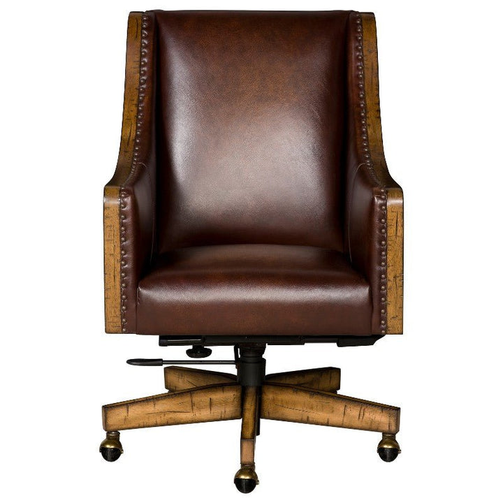 The Shard Office Swivel Chair - Fairfield Chair by Fairfield Chair is a brown leather office chair featuring wooden armrests and a studded trim. It boasts a high back, cushioned seat, and rests on a wooden swivel base with casters.