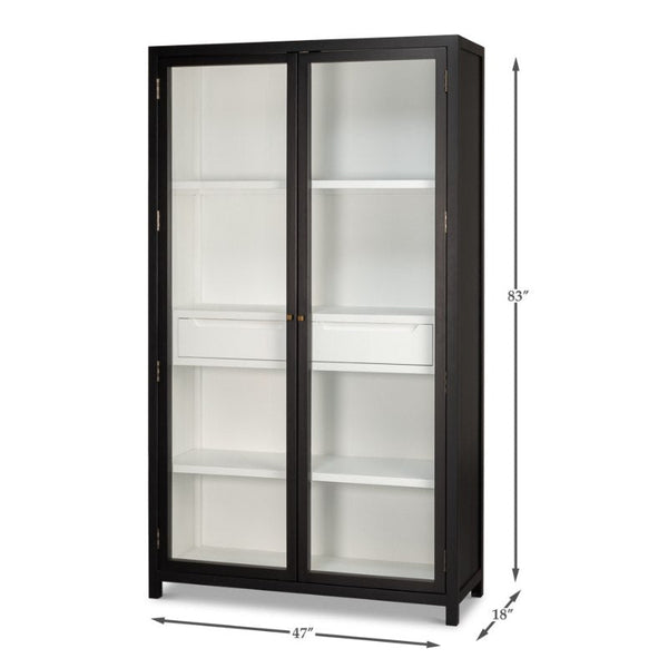 The Walker Bookcase by Sarreid is a tall, black-framed display cabinet with a brushed black exterior and two glass doors. Inside, it features multiple white shelves for storage or display purposes. The dimensions are 83 inches in height, 47 inches in width, and 18 inches in depth.