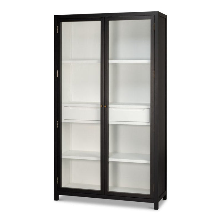 The Walker Bookcase by Sarreid is a tall, rectangular display cabinet with a brushed black exterior and two glass doors. Its interior is white, featuring several evenly spaced shelves for storage. The design seamlessly combines modern and minimalist styles with rustic elegance.