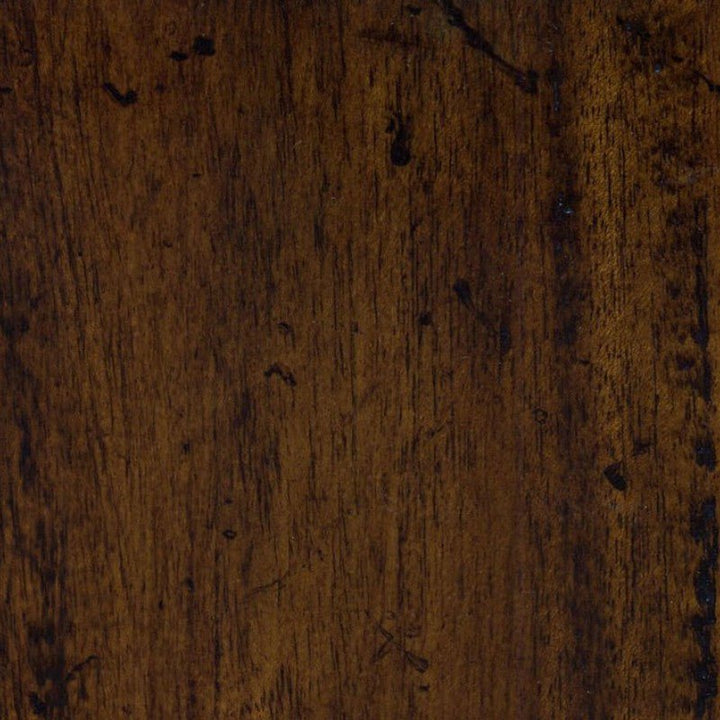 Close-up of a wooden surface with a dark, rich brown color and notable grain patterns, reminiscent of an antique brown leather top. The texture is slightly rough with visible knots and natural imperfections, giving the wood a rustic and weathered appearance, perfect for the Aston Court Wesley Writing Desk.