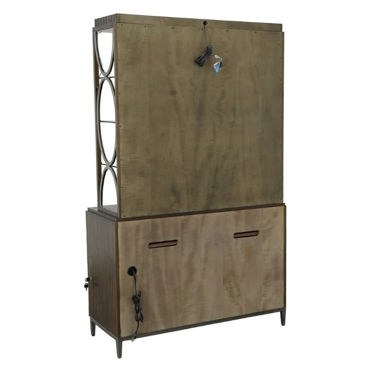 Introducing the West Camden Deck from Fairfield Chair, an industrial-style cabinet featuring a tall upper section with circular cutout designs on the side, and a lower rectangular storage unit with two slots. Electrical cords hang from both the upper and side sections. This piece from Fairfield Chair boasts a rustic Tahitian Pearl finish.