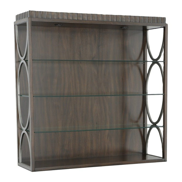 Immerse yourself in the timeless elegance of a wooden display case from Fairfield Chair, featuring the sophisticated Tahitian Pearl finish. This beautifully crafted piece includes adjustable glass shelves to accommodate your display needs. The front remains open while the closed sides are adorned with circular design elements, enhancing its aesthetic appeal. With three glass shelves inside, this dark, polished wood case is perfect for showcasing items and seamlessly complements any West Camden Deck décor.
