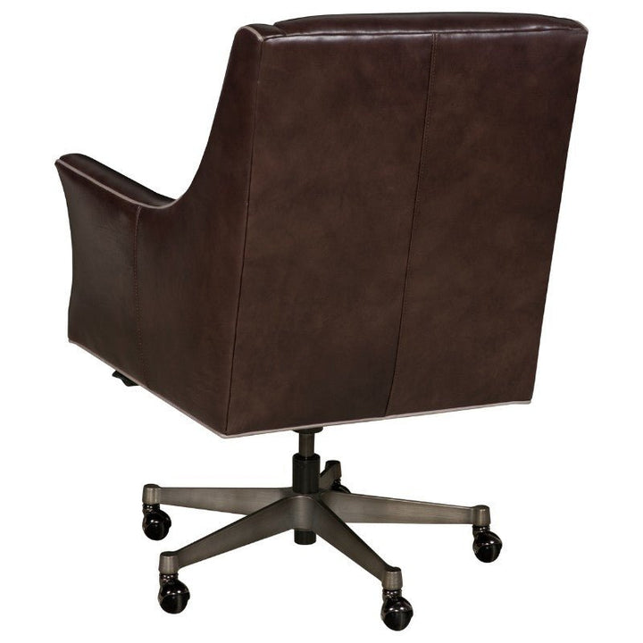 The Fairfield Chair Wriggly Office Swivel Chair, showcased from the back, is crafted with buttery-soft aniline leather. It features a high backrest, curved armrests, and a sturdy metal base with five casters for mobility. Its sleek lines and modern design make it a perfect fit for any professional office or study.